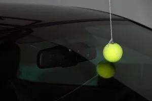 Tennis ball hanging from a string